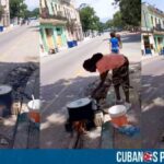 Cubanos cocinan con leña en plena calle habanera (+VIDEO)